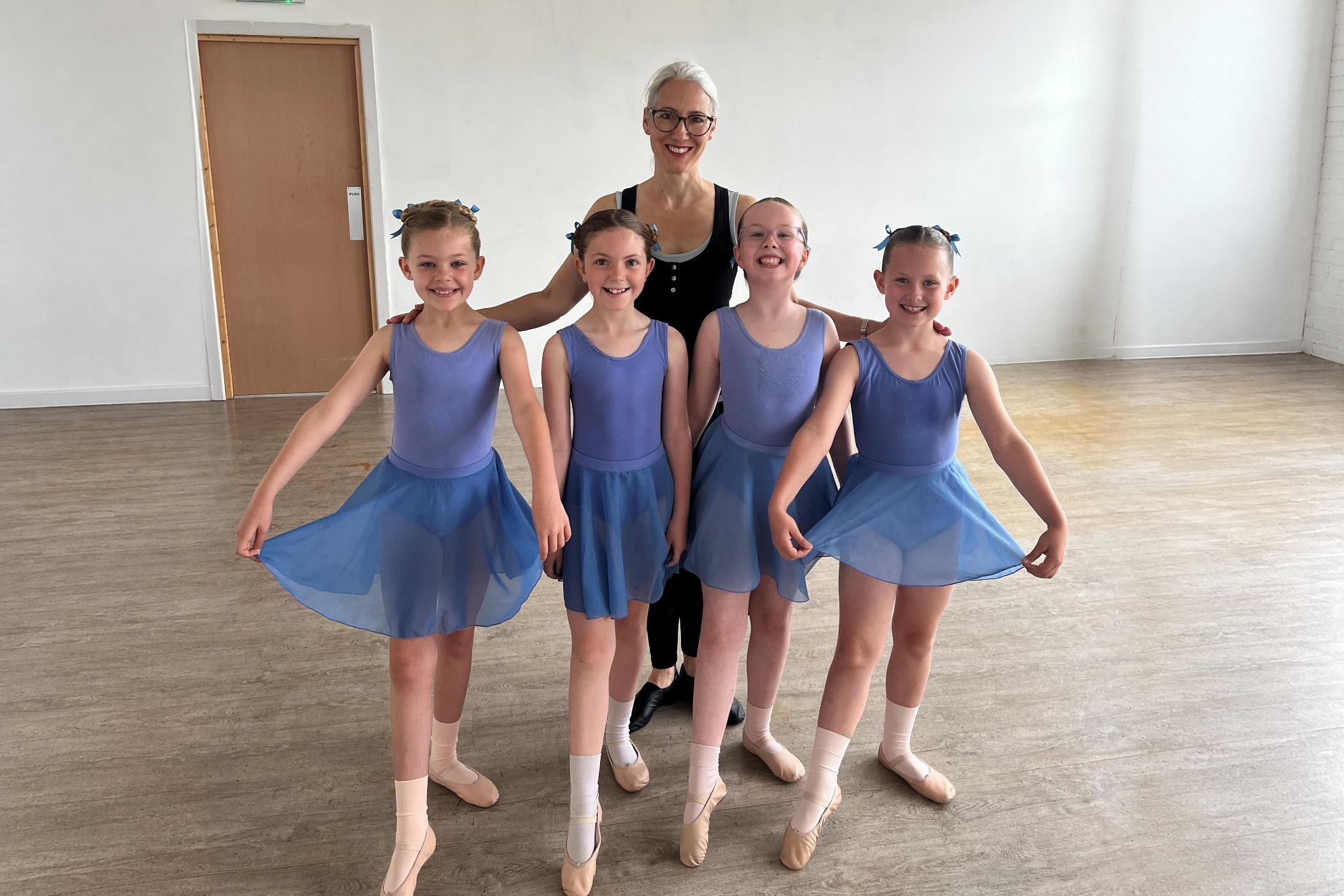 Kay Academy ballet dancers with their teacher