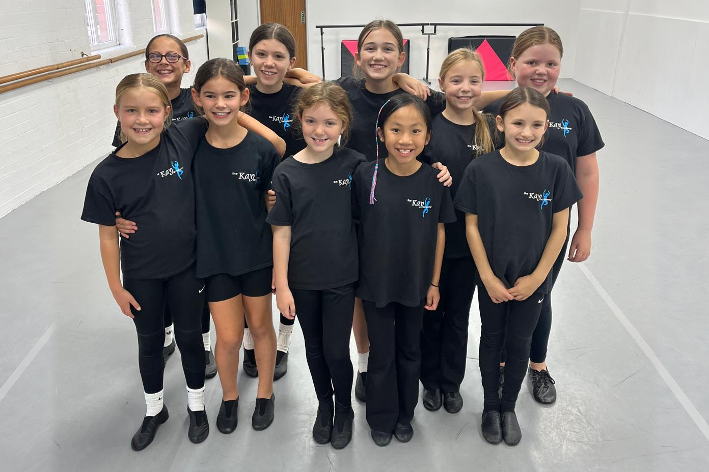 Kay Academy Jazz students smiling together in the studio